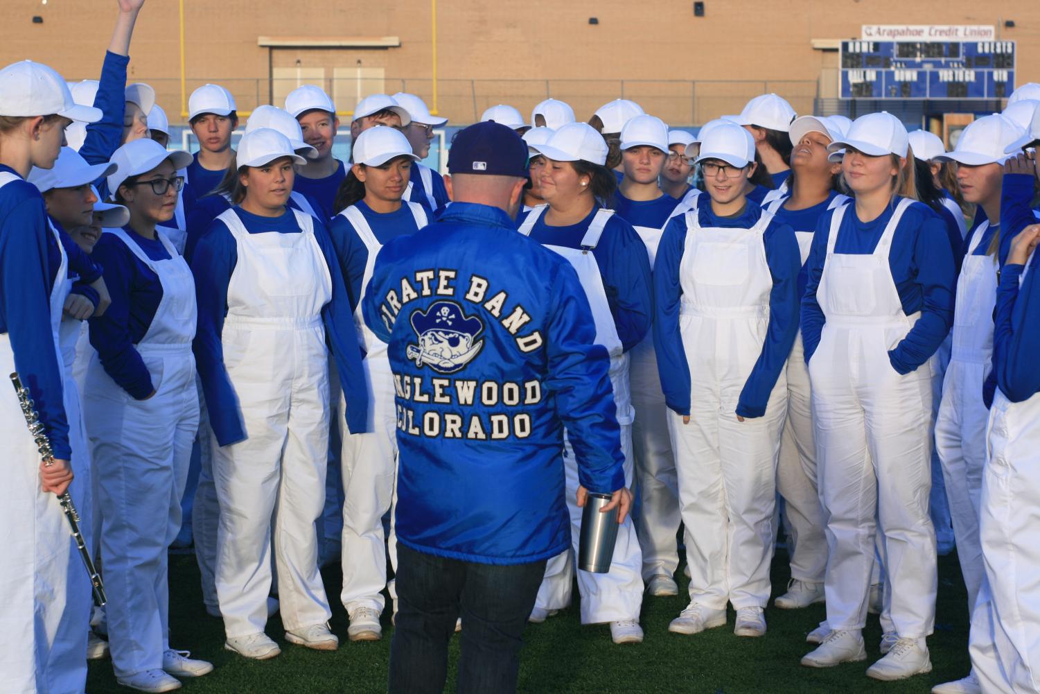 Band Director Phil Emery (in blue jacket) organizes students ahead of the state competition.