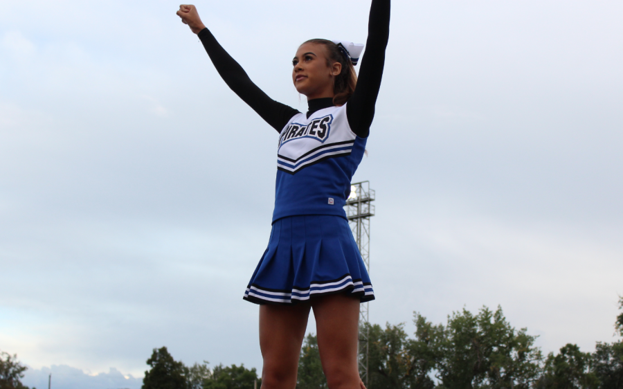 Bria Look (12) stands on top of a pyramid during a recent football game. 