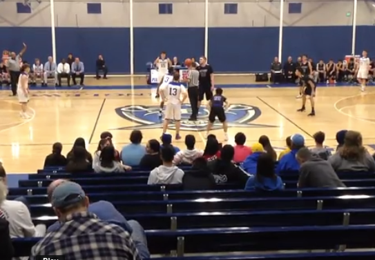 Josiah Hazard (11) won the tip over the 6'8"center from Skyview