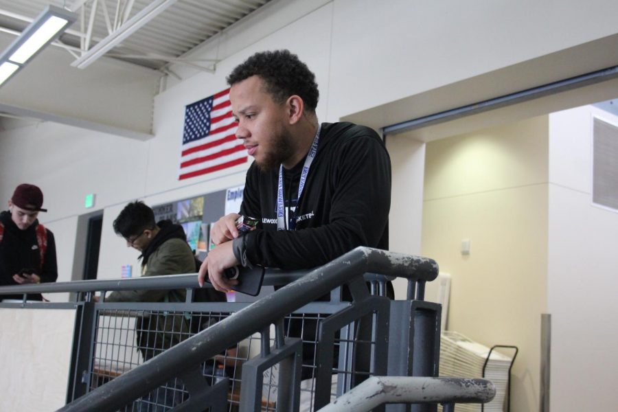 Security guard Marquise Evans overlooks students in the lunchroom.