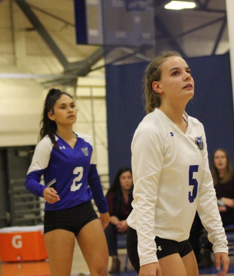 Jayda Brown #2 and Aspen Ridgeway #5, are in defensive mode waiting for the ball to come over the net. 