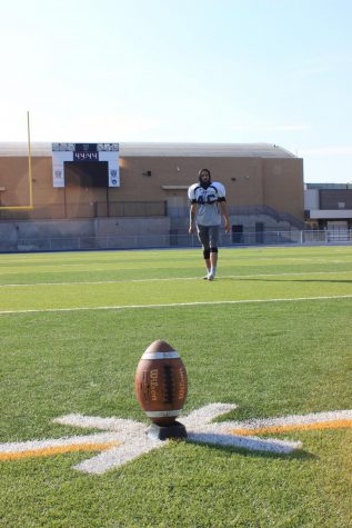 Chris Apodaca practices kicking the football. Apodaca averages 23 yard field goal with the longest kick being 43 yards.