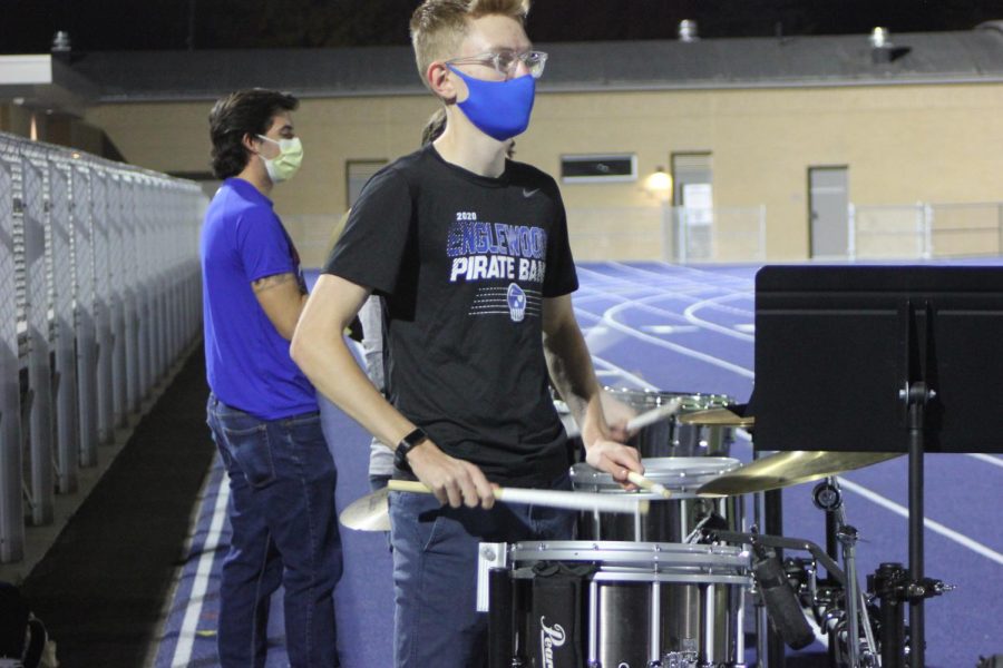 Sophomore Elliot Maschka drums up the crowd during the first home football game of the 2020 season against La Junta. 