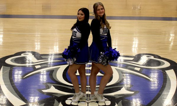 Senior Kaylee McCaskey (r) and senior Stephanie Montoya have been cheering together for years and have a tight bond. 