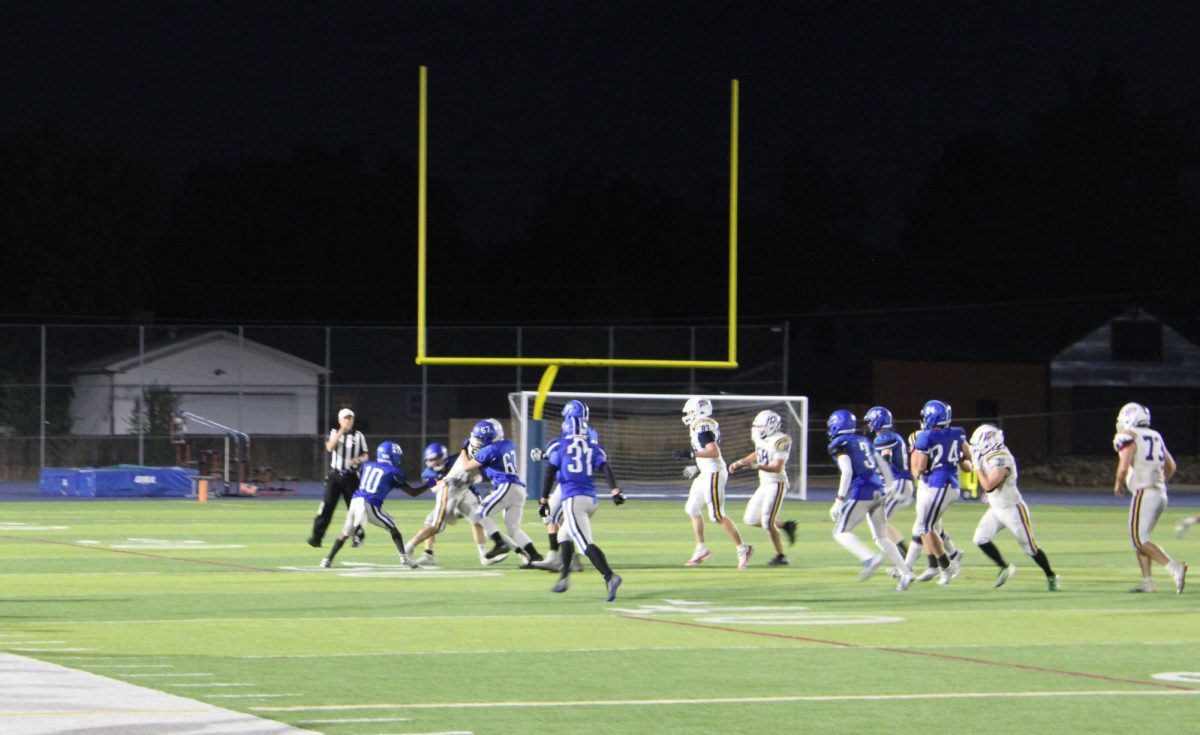 EHS offensive line pushes toward the goal in the game against Littleton. The Pirates won 63-0. 