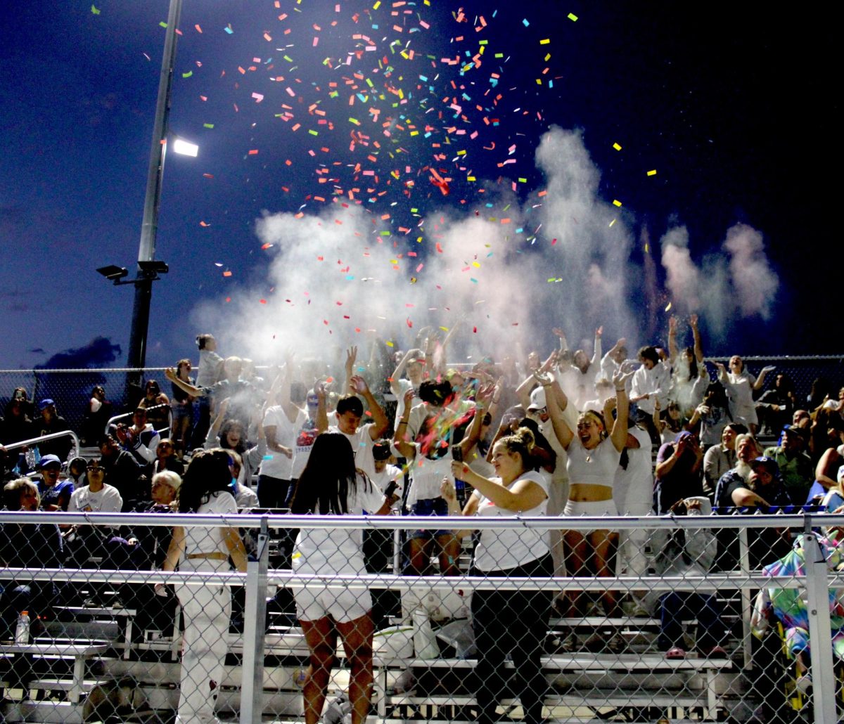 HoCo Whiteout game got students excited to throw powder after every touchdown. 