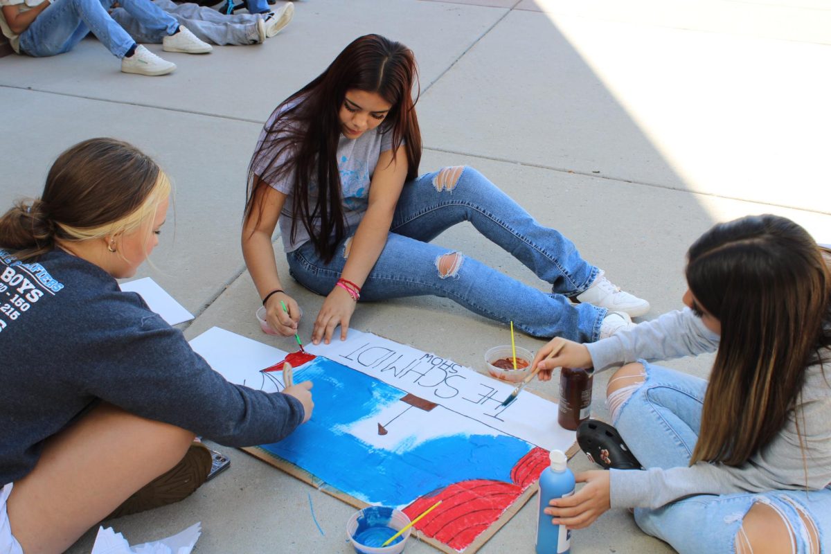 Students get their first chance to participate in Homecoming by painting their flag. 