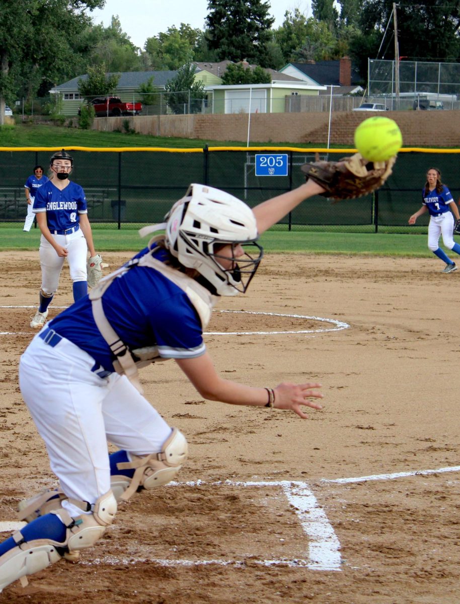 Protecting home plate, an Englewood catcher is in the right place at the right time to get the out. 