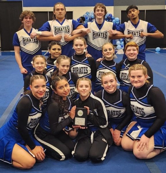 Holding the second-place trophy, the EHS competition cheer team spent hours perfecting their stunts for the event. 