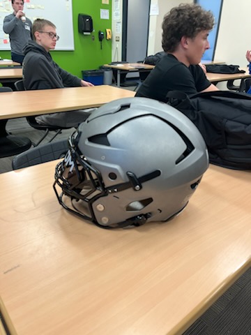 A sample of the Riddell Axiom helmets donated by the Broncos.