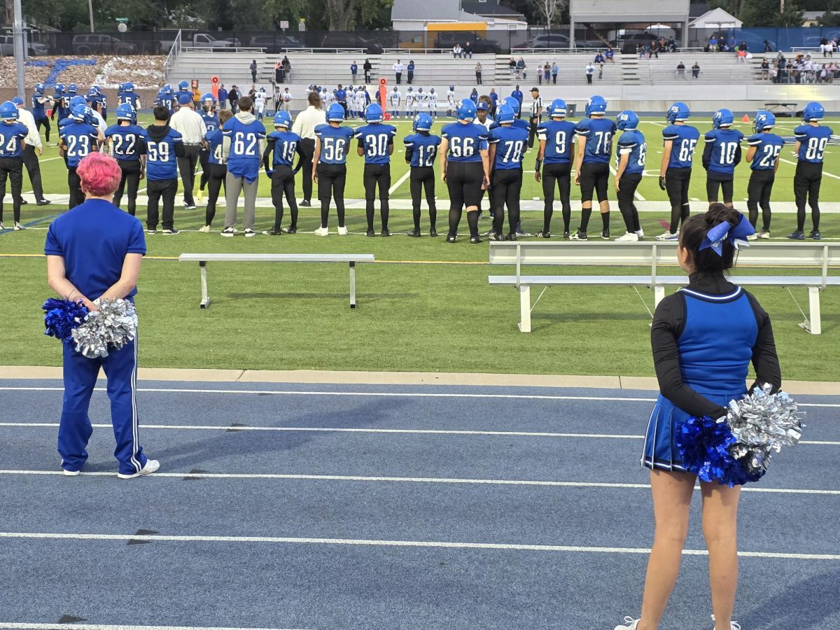 Junior Cody Boucher (right) has been part of the cheer team for two years. 