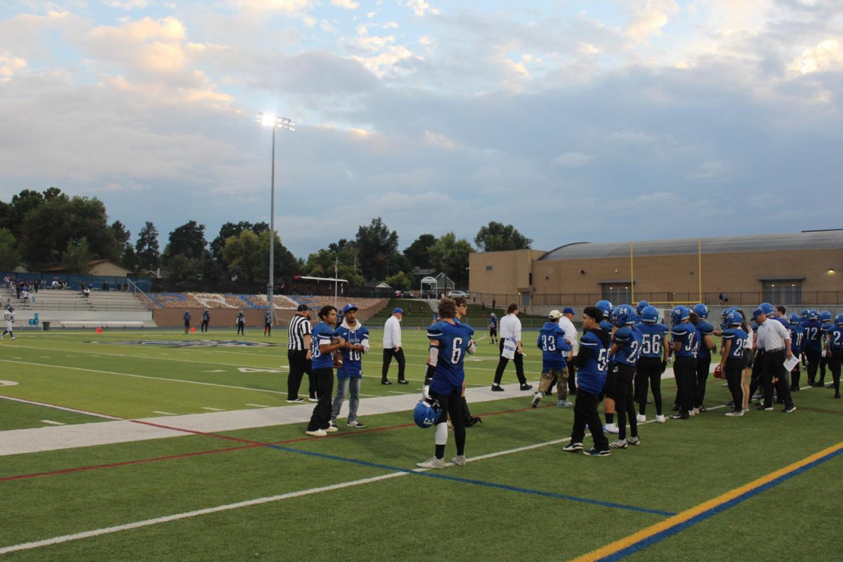 The Englewood High School Football team on the sidelines before the game against Hinkley High on August 29, 2025. 