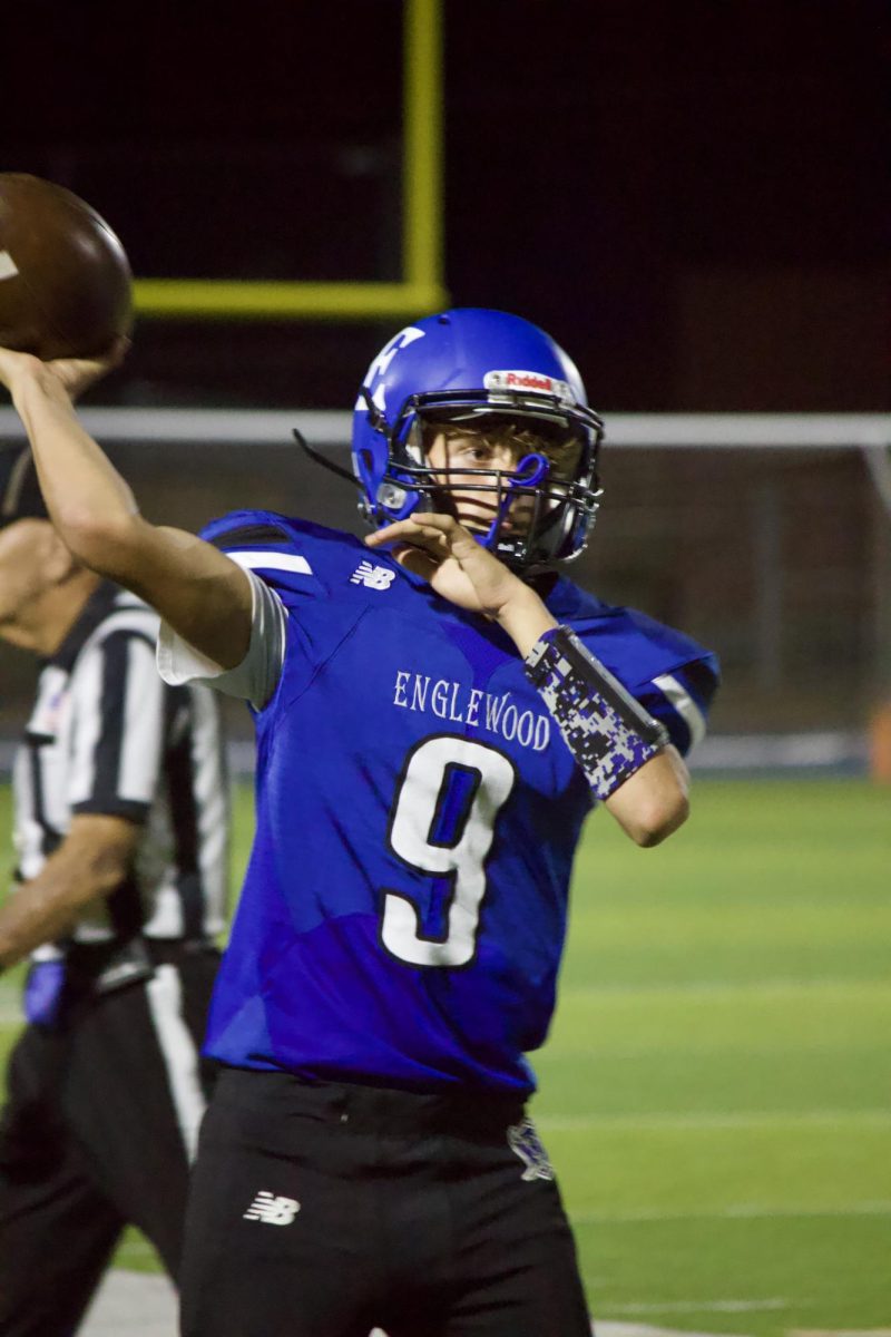 #9 Freshman Michael Kish practices on the sidelines during the blowout game vs Hinkley High. 