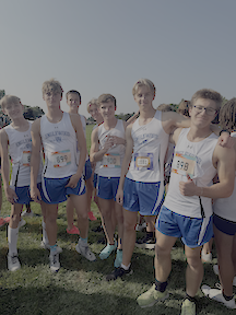 The cross country boys hyped for the  Steve Lohman invitational. Several runners had PRs. 